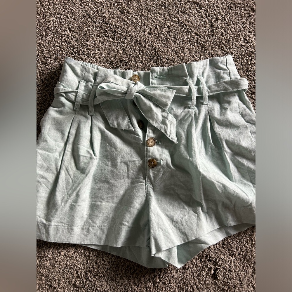 High waist linen button closure shorts with tie.